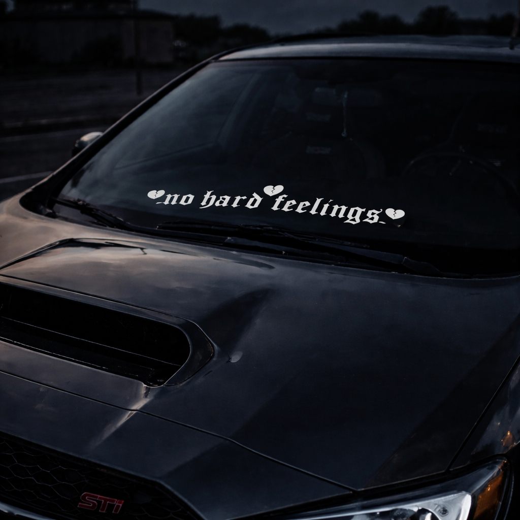 Black car with 'no hard feelings' decal on windshield